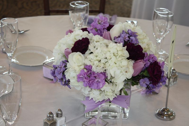We created the brides bouquet with white phlox deep purple callas 