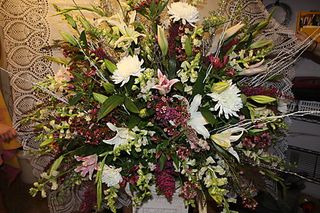 pink heather, white and pink lily, pink larkspur, white mums, alstra maria lily, wax flower