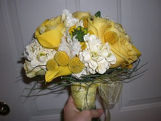 Yellow calla lily, yellow billy balls, yellow roses, pale yellow stock, white fringed tulips, engaged magazine