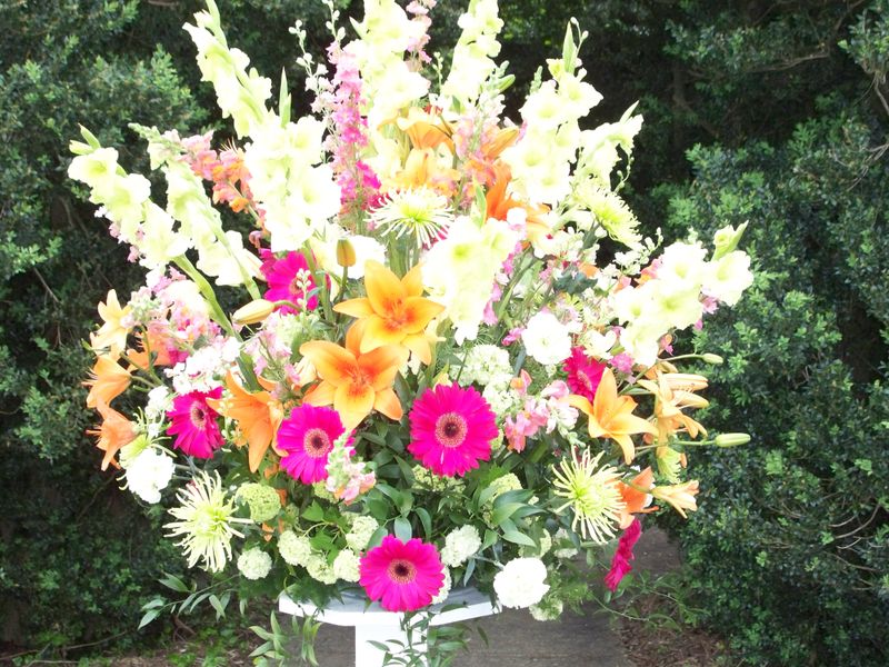 Gerber Daisy, lily, gladiola, mum