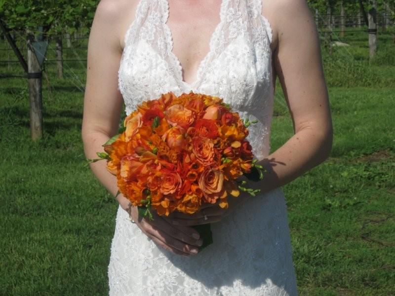 Ranunculus, Tulips, milva roses, orange Freesia, Celosia, Orchids, Star of Bethlehem