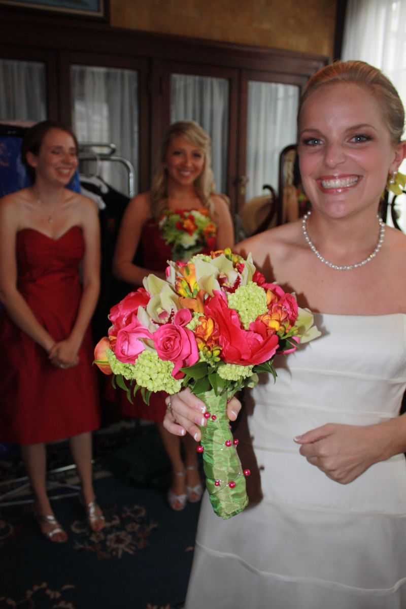 hot pink peonies, green Cymbidium Orchids, orange Callas, Roses, green Viburnum