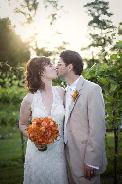 Tulips, orange Ranunculus, orange Star of  Bethlehem, orange Roses, orange Freesia, orange Orchids, orange Celosia, Loudoun Weddings