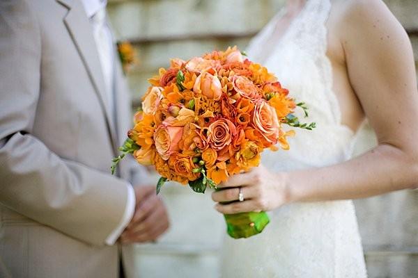 Tulips, orange Ranunculus, orange Star of  Bethlehem, orange Roses, orange Freesia, orange Orchids, orange Celosia, Loudoun Weddings