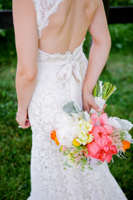 Bridal bouquet by designer Sue Prutting of White Magnolia Designs – Maryland, with coral charm peonies, astilbe, cream stock, craspedia and dusty miller