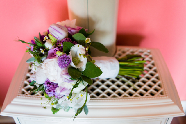 Wedding bouquet by Designer Faye Zierer Krause of Flora Organica Designs - California, with lilacs, hellebores, lisianthus, purple tulips, white peonies and strawberry blossoms