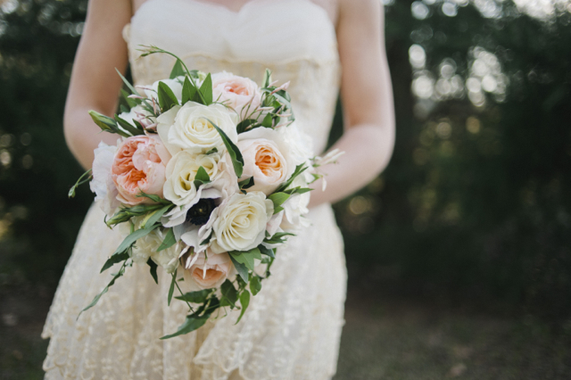 Bridal bouquet by Designer Meredith Young of Au Courant - Jackson, Mississippi, with Juliet garden frose white roses, anemone and jasmine vine