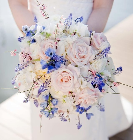 Bridal bouquet by designer Lisa Sommer of Petals and Promises - Silver Spring, Maryland, with delphinium, muscari, genestra, blush roses, white sweet pea and ranunculus